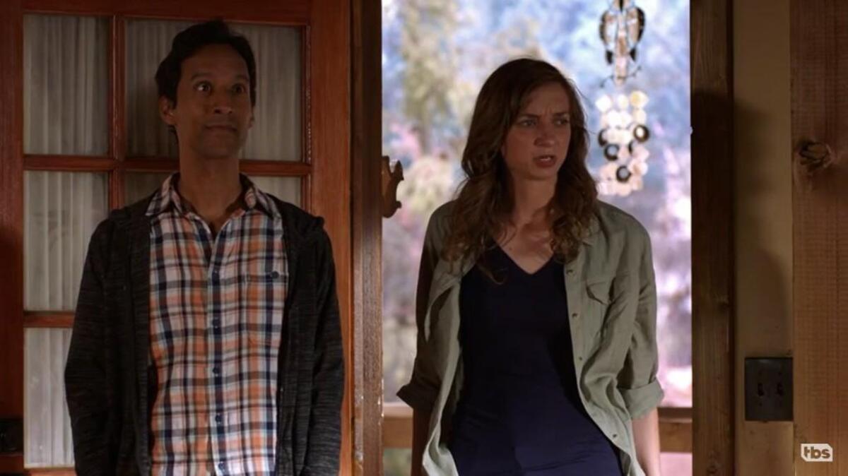 Danny Pudi, left, and Lauren Lapkus in “The Guest Book” on TBS.
