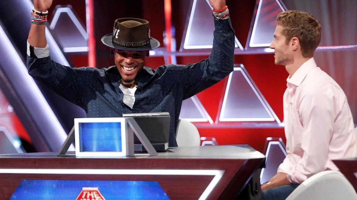 Carolina Panthers quarterback Cam Newton, left, and contestant Joe Slaughter, on “$100,000 Pyramid” on ABC.