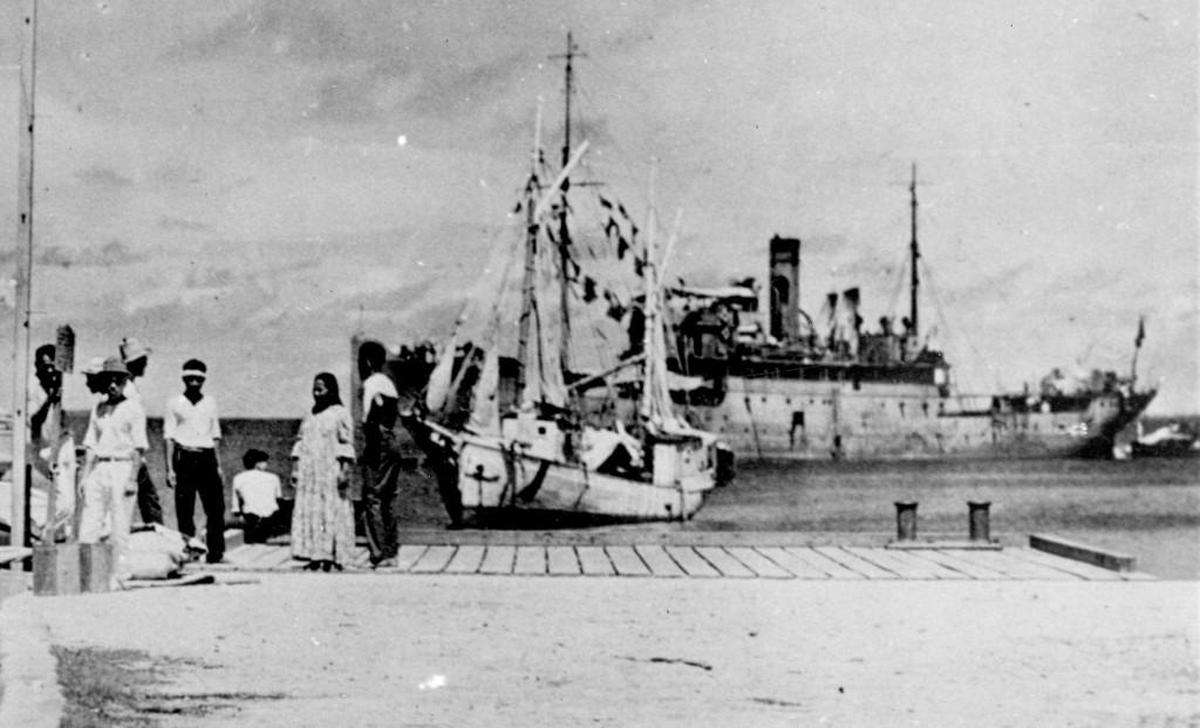 This photo released by the US National Archives shows a group of people standing on a dock on the Jaluit Atoll, Marshall islands, in the 1930’s. Navigator Amelia Earhart is believed to be the woman sitting on the dock with her back to the camera. A History Channel special suggests that Earhart may have been taken prisoner by Japanese forces.