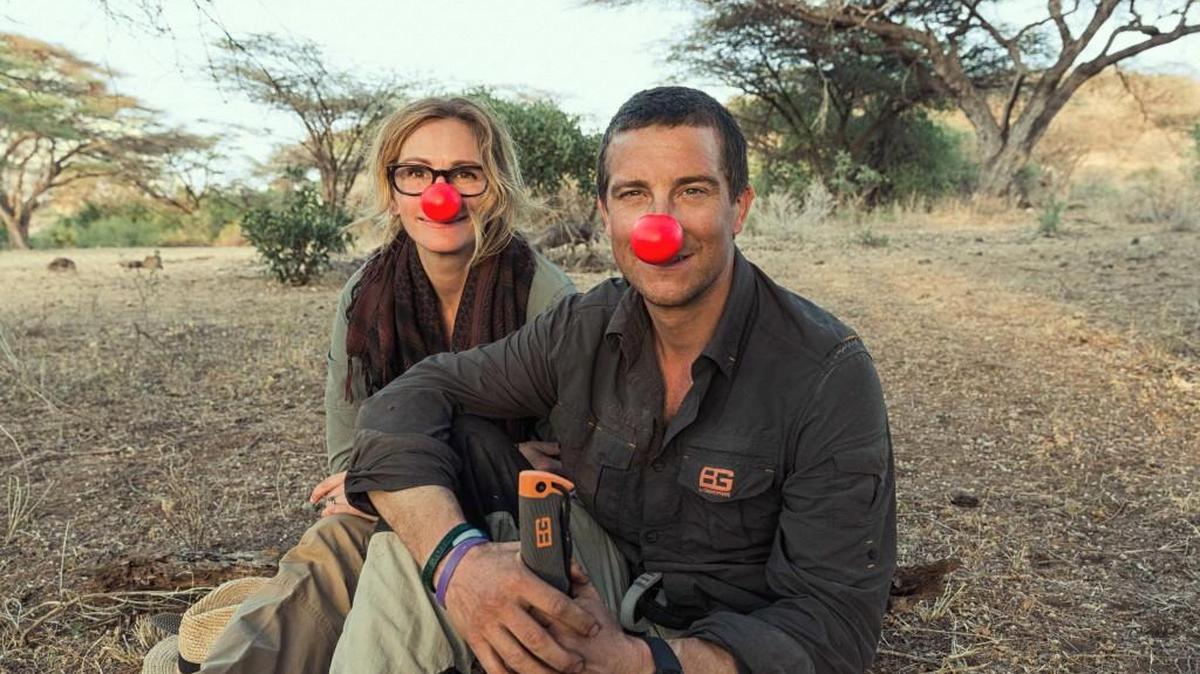 Julia Roberts, pictured here with Bear Grylls, appears in a special “Red Nose Day” episode of “Running Wild With Bear Grylls” on NBC.