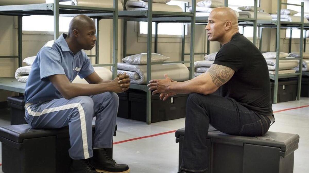 Inmate Timothy Williams, left, and Dwayne Johnson in the HBO documentary “Rock and a Hard Place.”