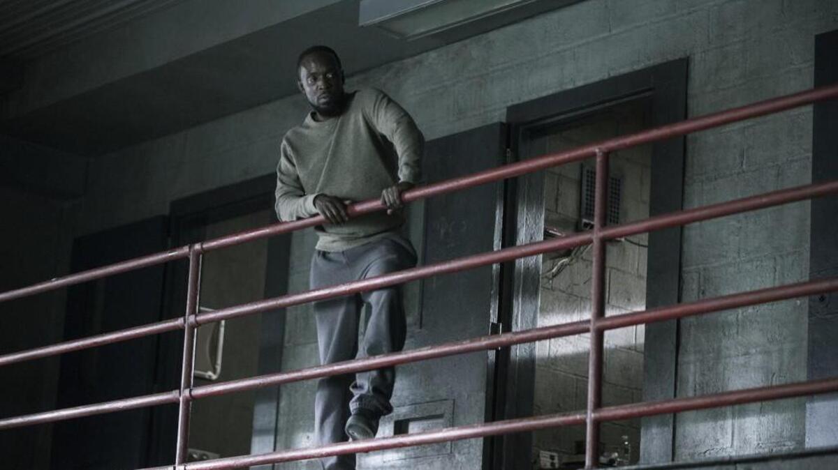 Naz realizes his survival rests in the hands of one particular inmate, played by Michael Kenneth Williams (pictured here).