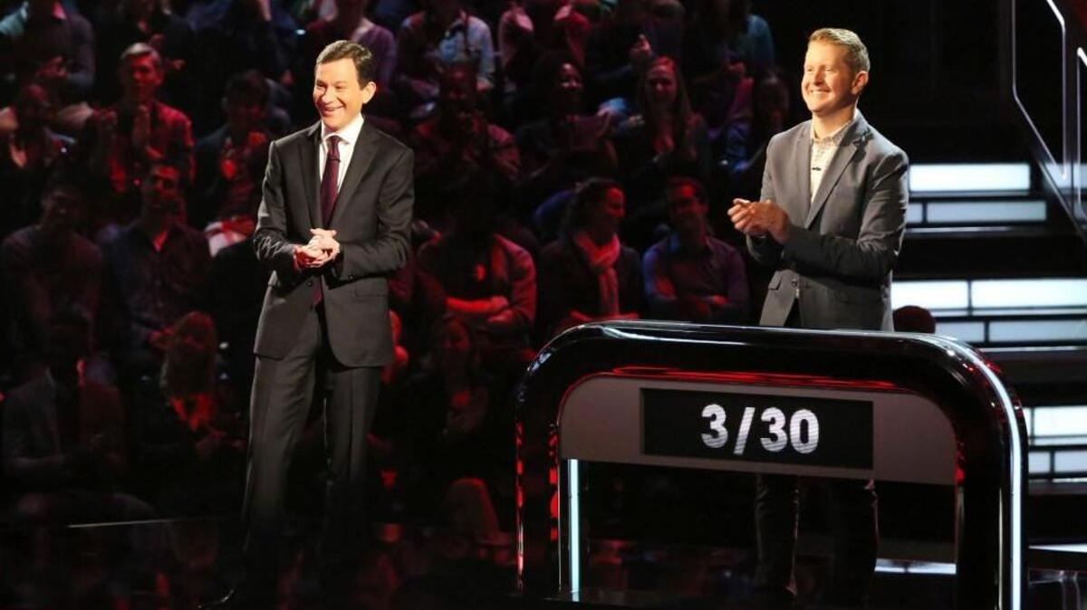 Dan Harris (left) hosts as the all-time greatest “Jeopardy!” winner and best-selling author Ken Jennings (right) competes on “500 Questions.”
