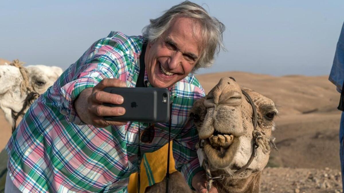 Henry Winkler takes a selfie with a camel in Morocco in the Season 2 finale of “Better Late Than Never.” He will be at Raleigh Supercon.