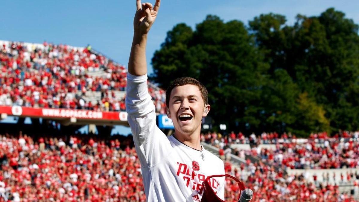 Scotty McCreery gives the Wolfpack sign after singing the National Anthem before N.C. State’s game against Central Michigan on Oct. 8, 2011 at Carter-Finley Stadium in Raleigh.