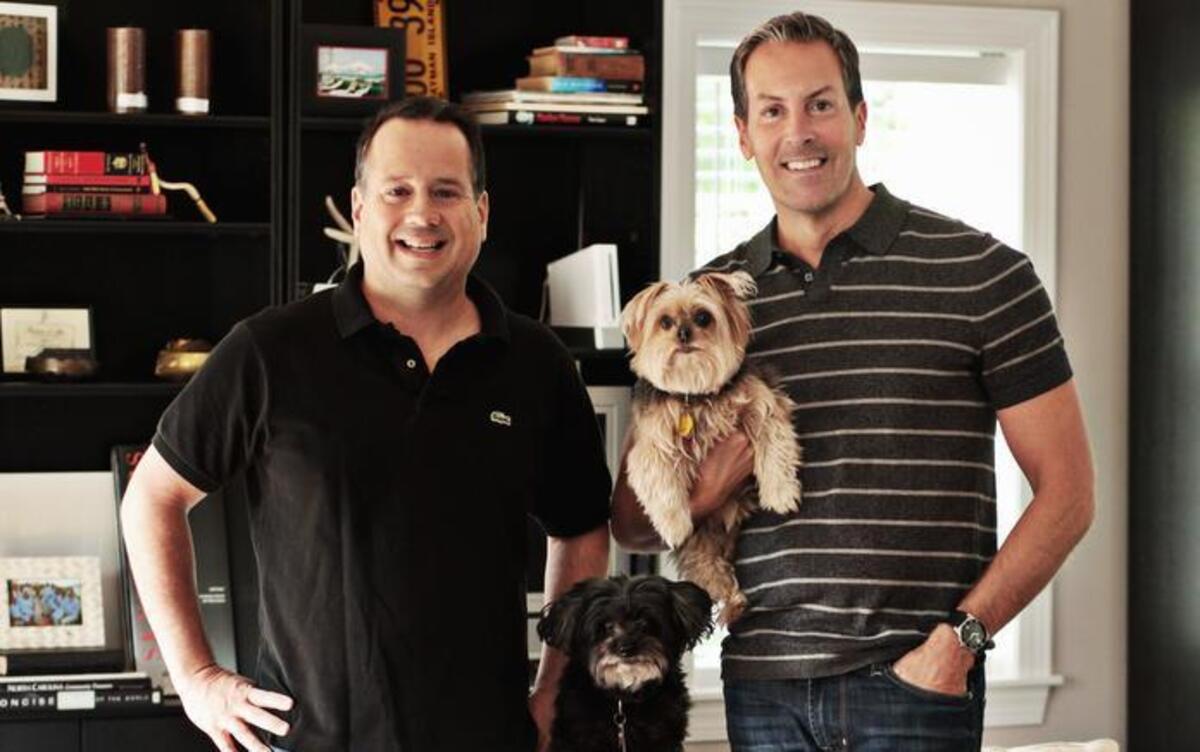 
Homeowners Rodolfo De Martino, left, and Greg Sims with their dogs Sarah and Sissi at their Mordecai home.
