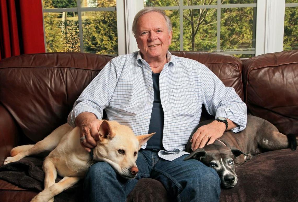 Larry Stogner, photographed in his Durham home days before his last broadcast as the WTVD anchor. Stogner was photographed with his dogs Beauty, right, and Beast, left, on Feb. 4, 2015. He announced 2 weeks prior that he had ALS and was retiring.