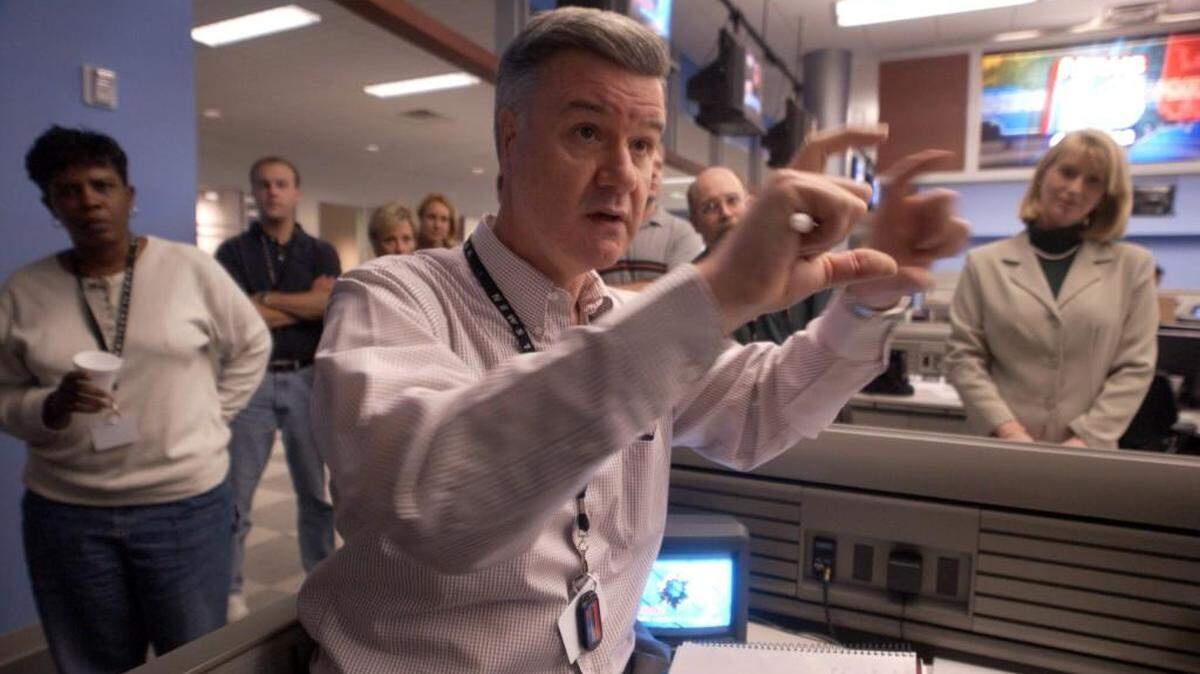 News director Rick Willis (center), photographed in 2002 in the Time Warner News 14 Carolina newsroom in Raleigh.