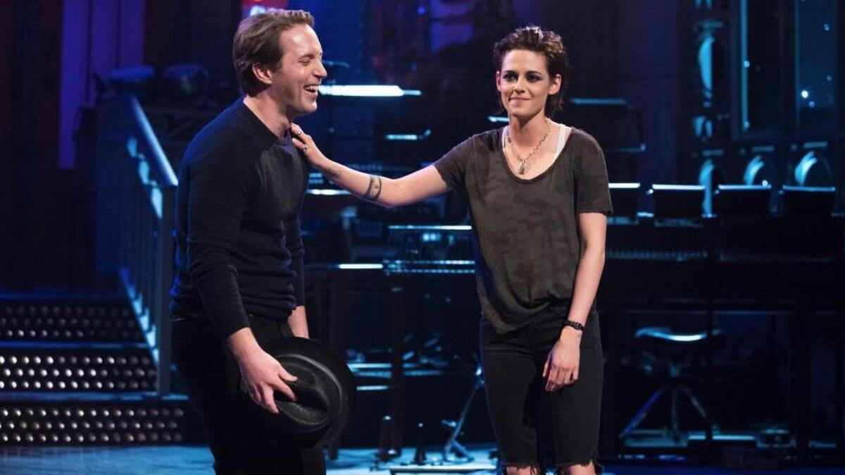 “Saturday Night Live” cast member Beck Bennett, left, with this week’s host, Kristen Stewart.