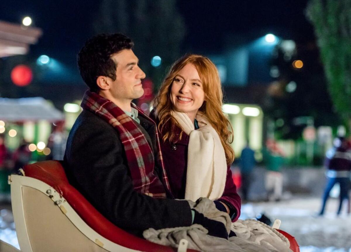 David Alpay, left, and Alicia Witt in the Hallmark movie “Mistletoe Inn.”