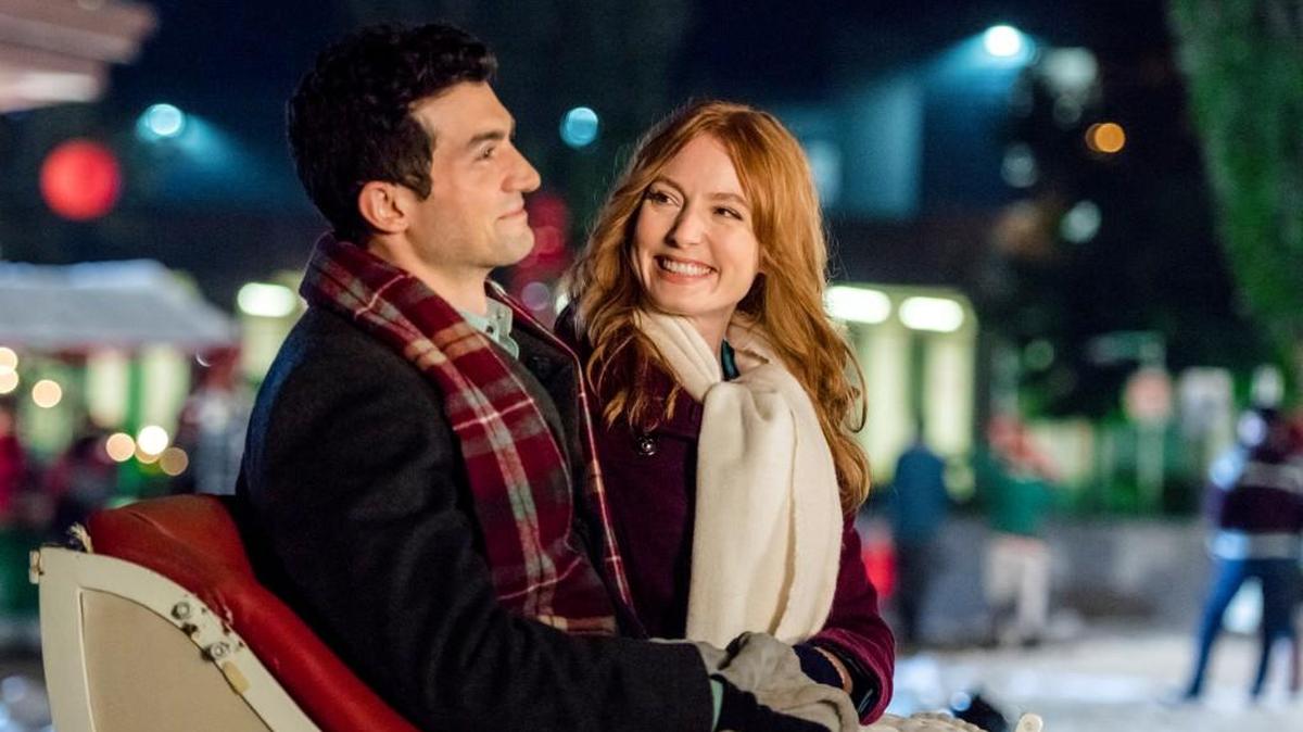 David Alpay, left, and Alicia Witt in the Hallmark movie “Mistletoe Inn.”