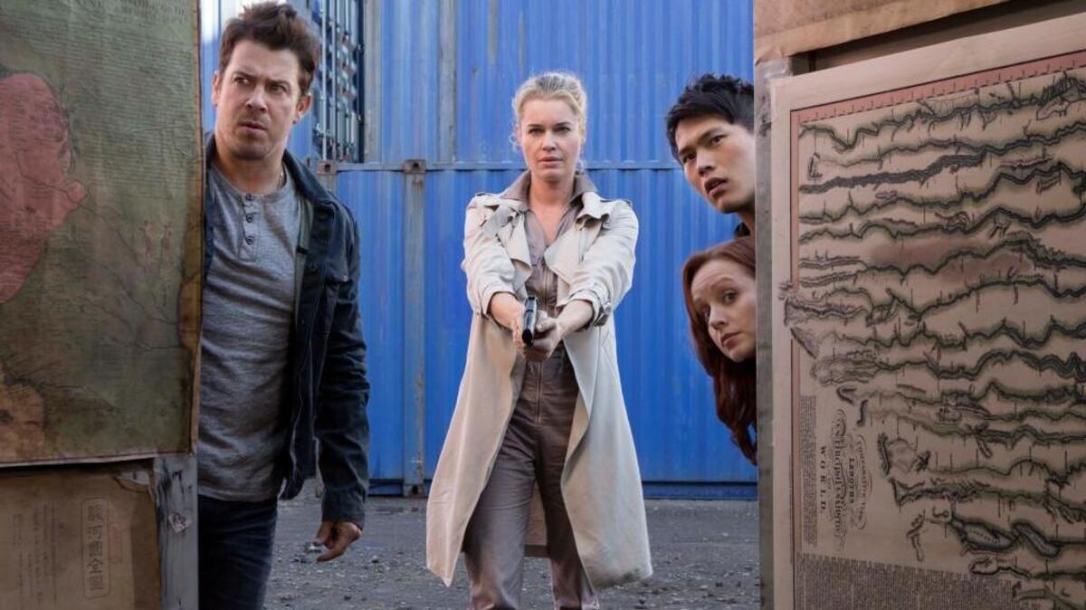 (L-R): Christian Kane, Rebecca Romijn and John Kim in “The Librarians.”
