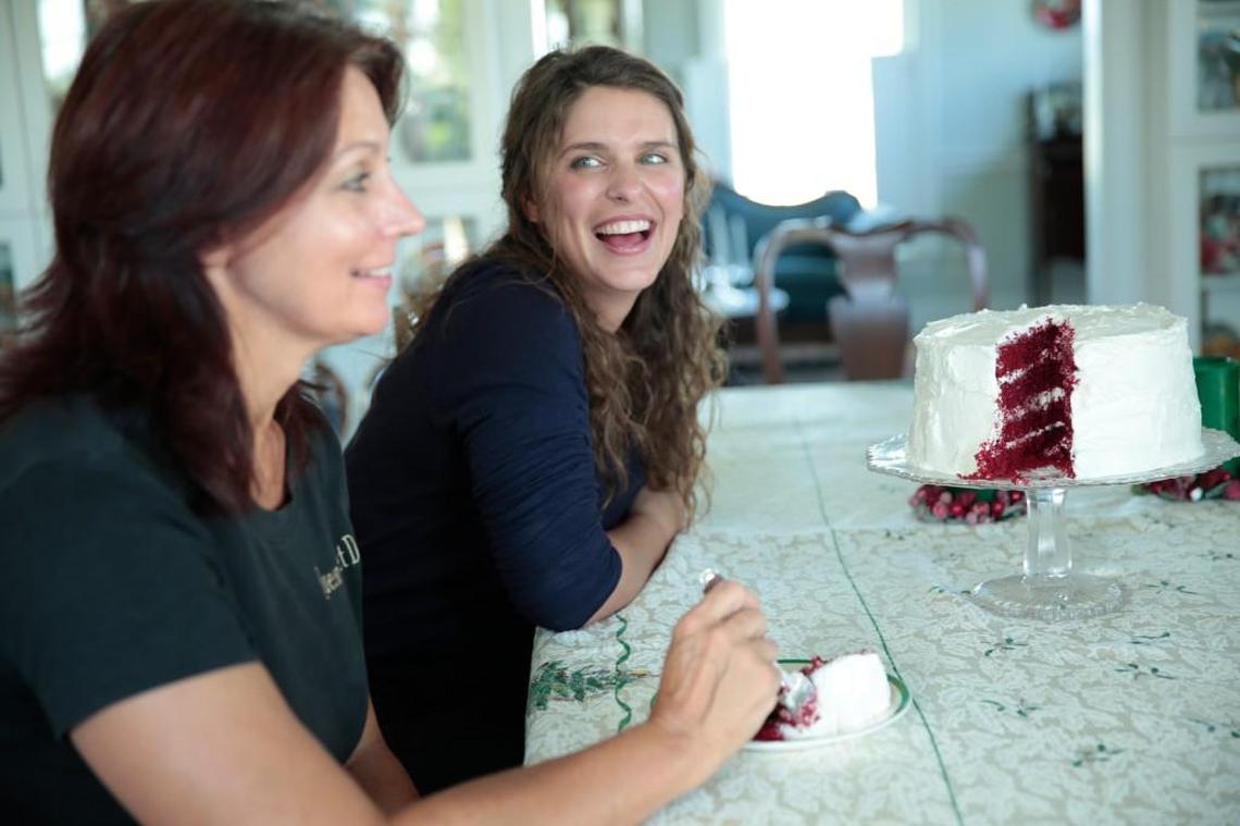 Chef Vivian Howard, right, and her sister Leraine, left, pepare a red velvet cake in the “Chef’s Life Holiday Special.”