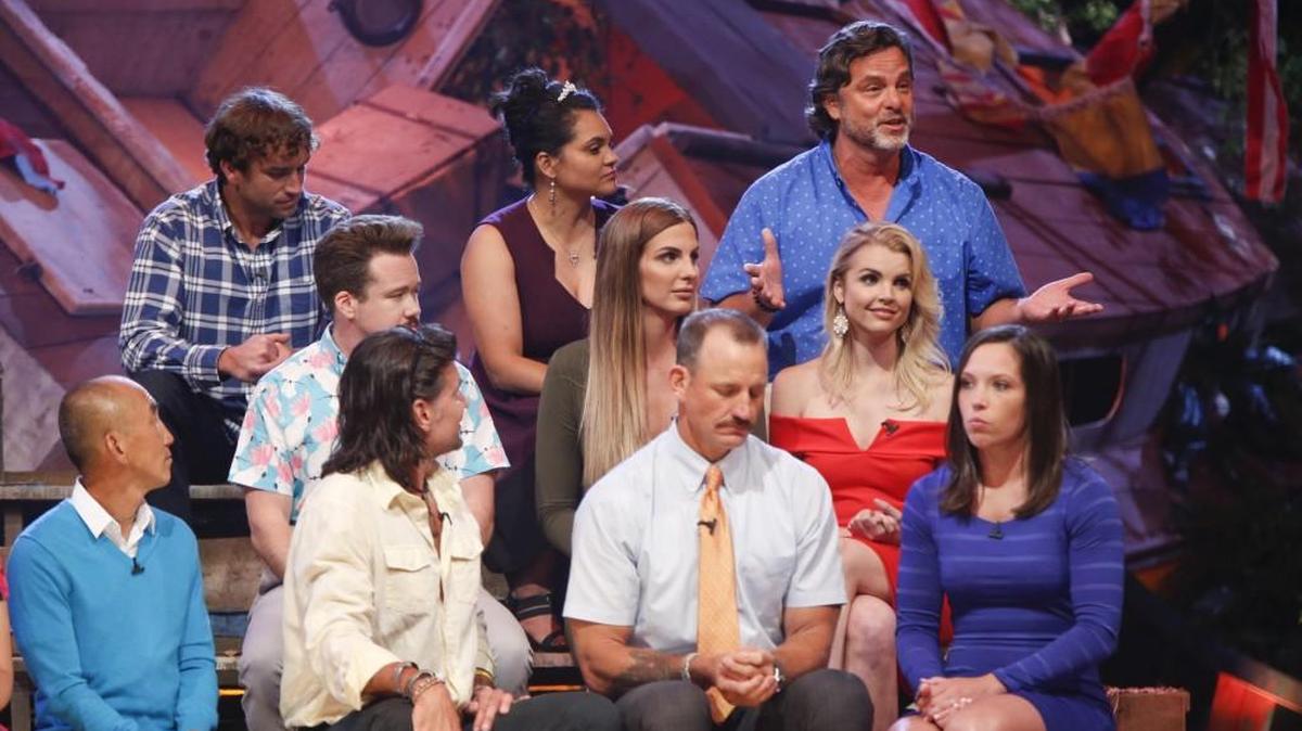 Jeff Varner, back row at right, explains how he regrets outing Zeke Smith, middle row on left, as transgender. The two, along with other ‘Survivor: Game Changers’ contestants, appeared in a live finale from Los Angeles on Wednesday night.