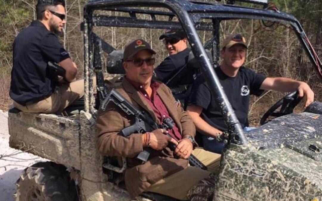 Andrew Zimmern, host of “Bizarre Foods” on the Travel Channel, in passenger seat next to driver Jody Rhodes as they head out to look for Johnston County wild boar.