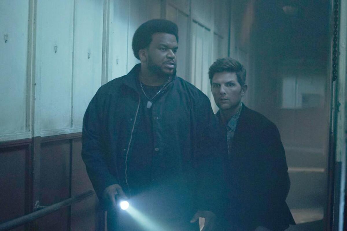Craig Robinson, left, and Adam Scott in “Ghosted” on Fox.