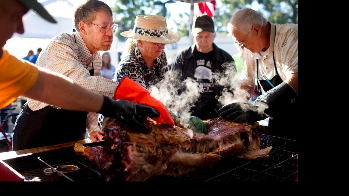 
This is what Carolina-style whole hog barbecue looks like: Judges check the skin on a hog at The N.C. Whole Hog Barbecue State Championship in Raleigh in 2013.


