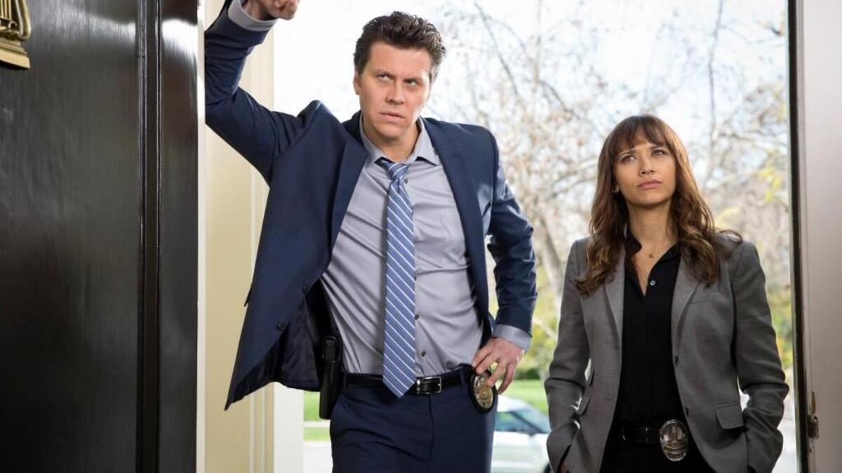 Hayes MacArthur, left, and Rashida Jones star in “Angie Tribeca” on TBS.
