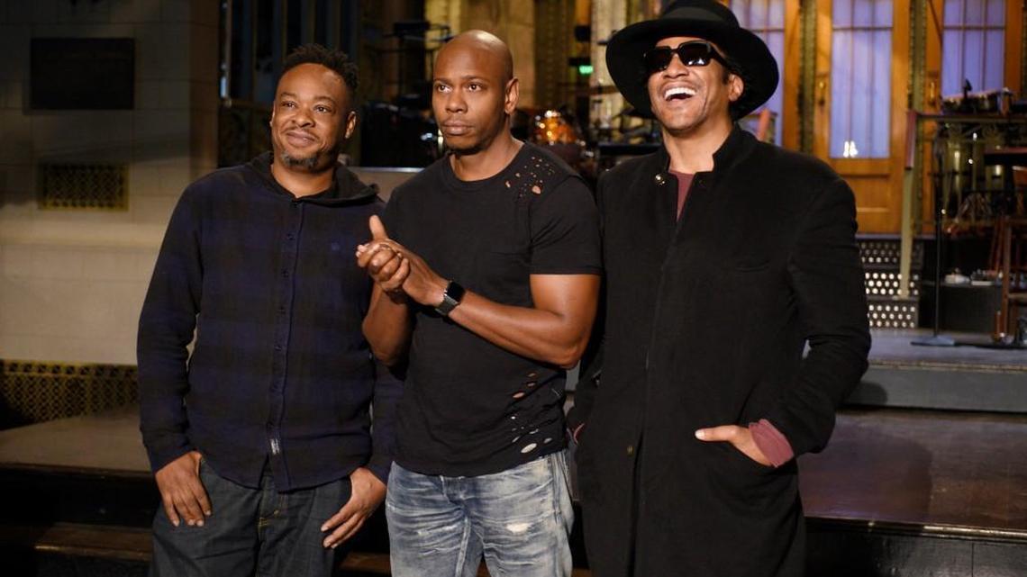 Comedian Dave Chappelle, center, with members of the group A Tribe Called Quest, Jarobi White, left, and Q-Tip, right.