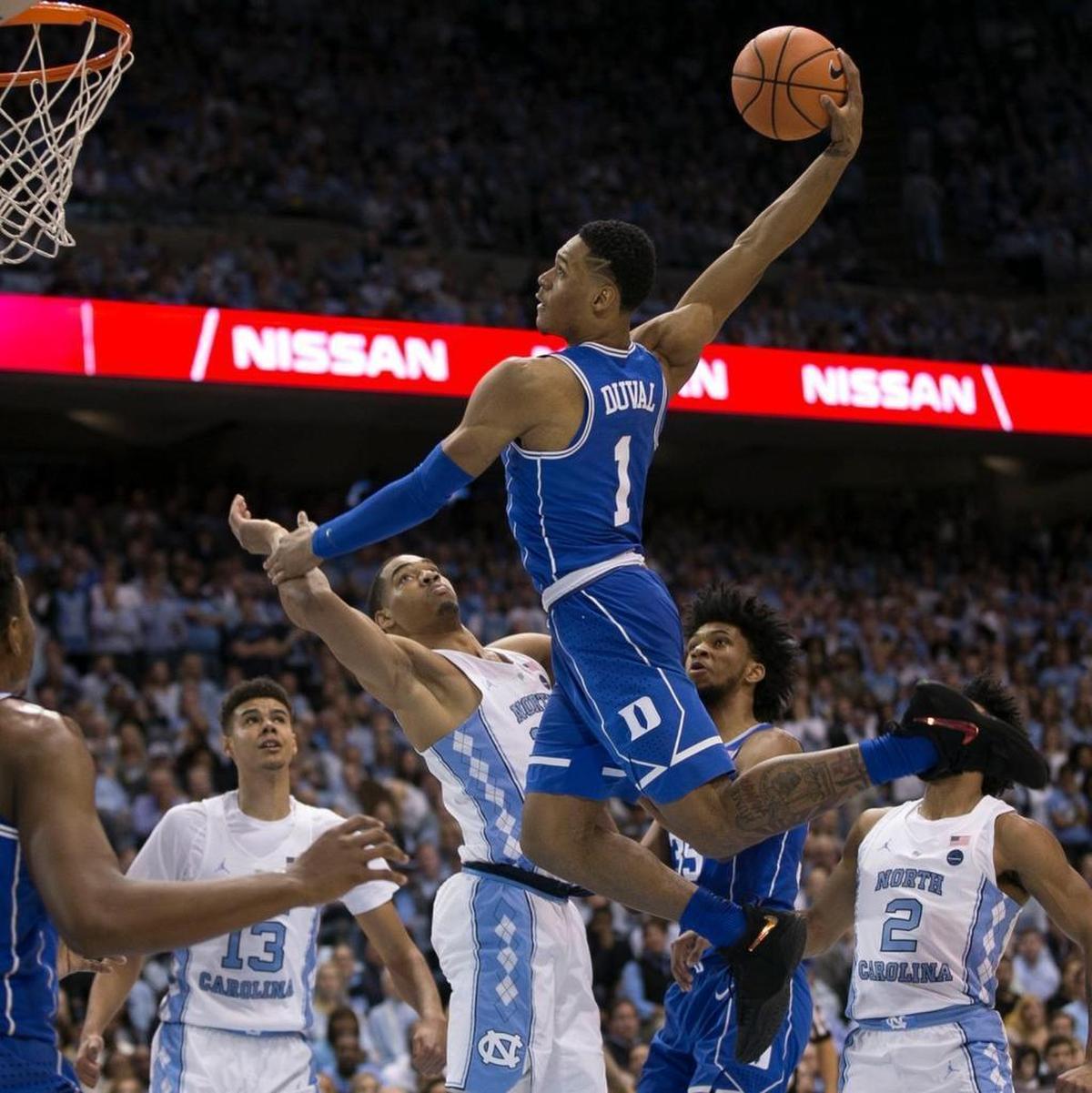 Duke’s Trevor Duval drives to the basket for a dunk over North Carolinas Garrison Brooks during a Feb. 8 game at the Smith Center in Chapel Hill.