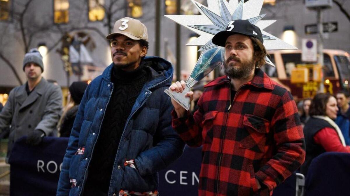 Casey Affleck, right, hosts “Saturday Night Live” with musical guest Chance the Rapper, left.
