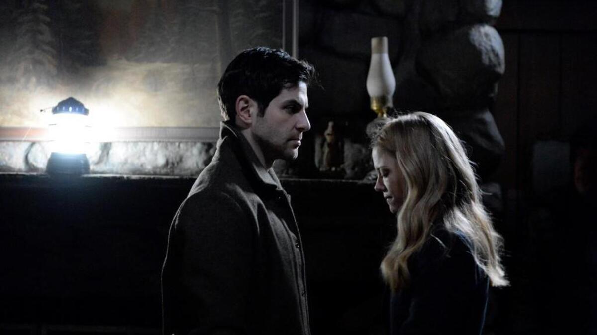 David Giuntoli, left, as Nick Burkhardt and Claire Coffee as Adalind Schade in “Grimm” on NBC.