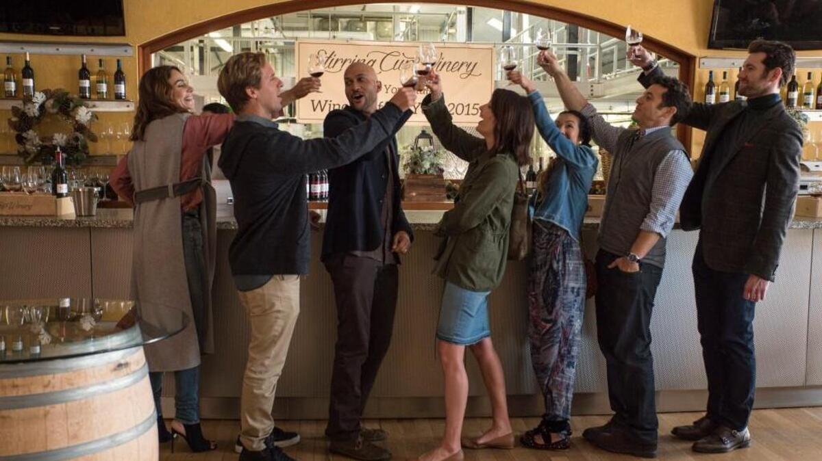 (L-R): Annie Parisse, Nat Faxon, Keegan-Michael Key, Cobie Smulders, Jae Suh Park, Fred Savage and Billy Eichner in “Friends From College” on Netflix.