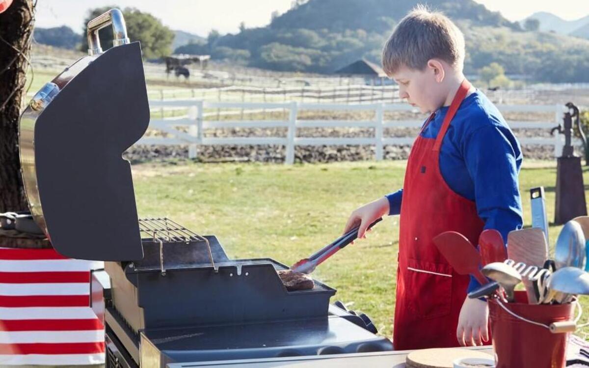 Contestant Gill Corbett, 11, of Chapel Hill, preparing his Round 1 dish, fresh herb italian sausage, as seen on Kids BBQ Championship, Season 2.
