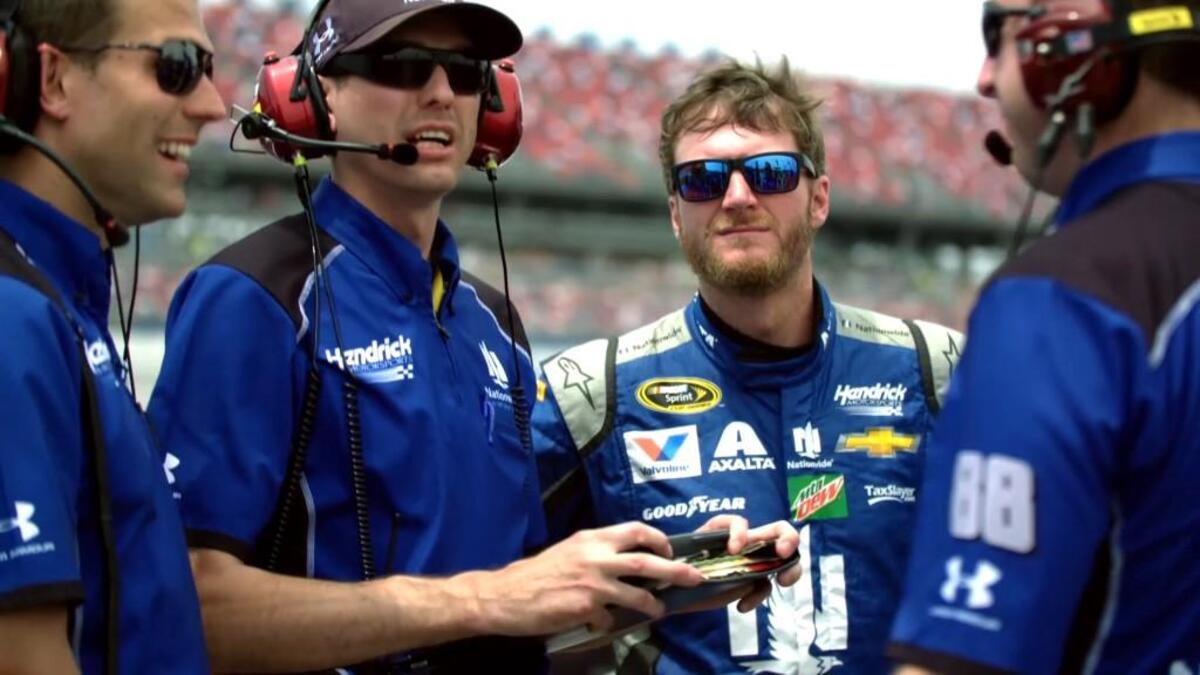 Dale Earnhardt Jr. (center) talking to his crew chief Greg Ives (second from left).