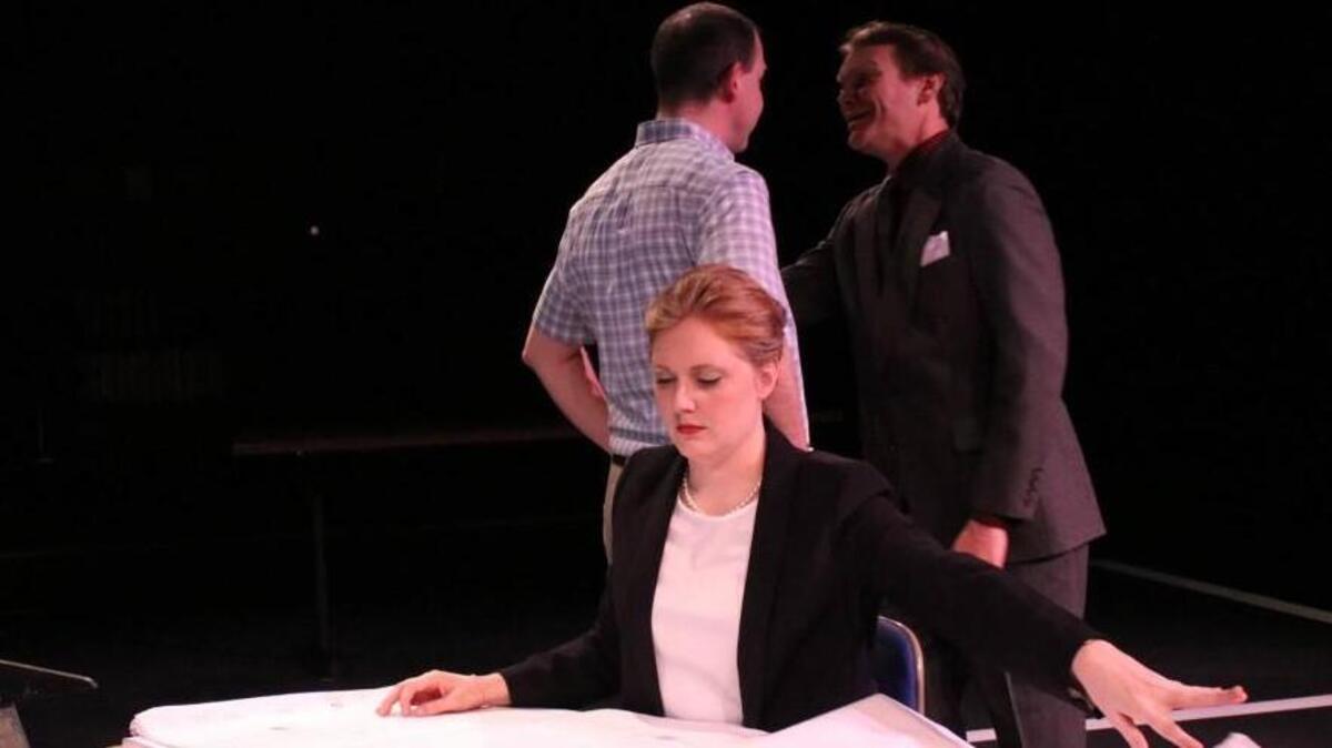 Samantha Corey is Eliza in “What We’re Up Against,” presented by Raleigh Little Theatre, which addresses sexist behavior and gender equality in the workplace. Brian Westbrook and Dan Cullen also star.