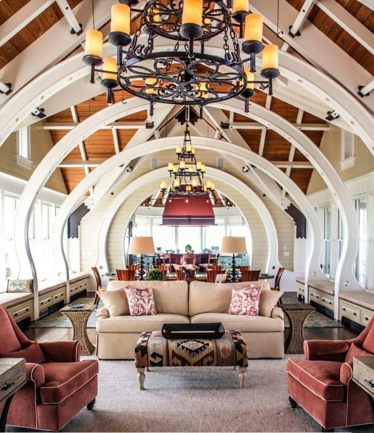 The kitchen and dining areas open into the main living space in “the belly” of the whale-like structure.