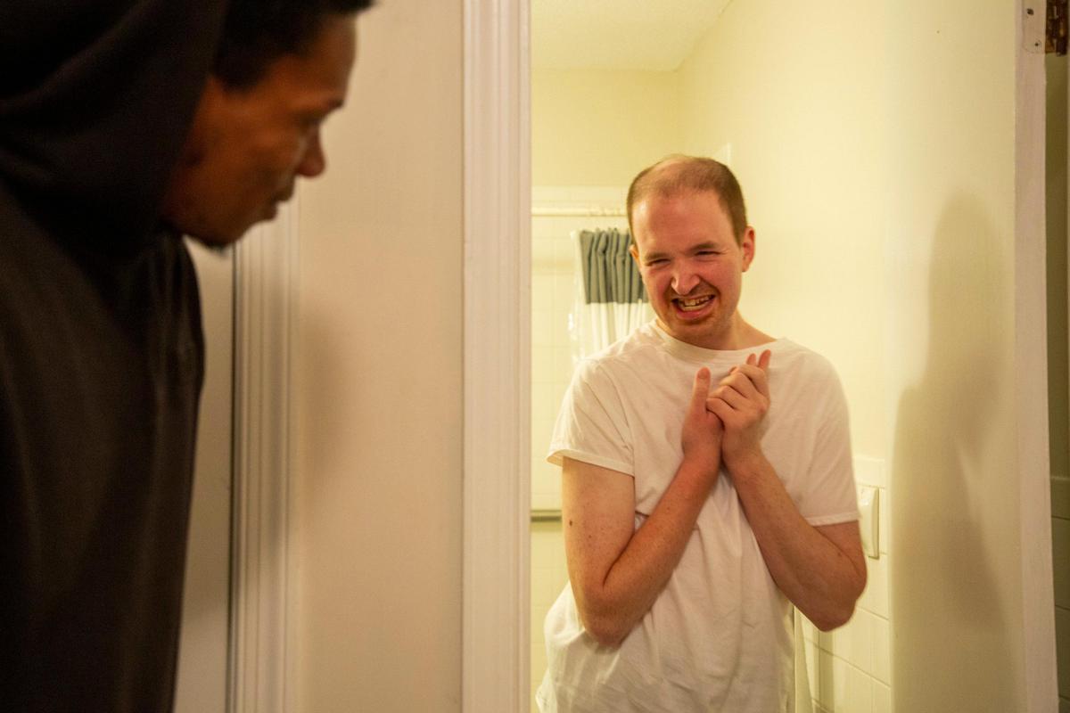 Dylan Hoyt, 29, hangs up his bath towel after a shower in Hoyle’s own home which he has lived in despite a diagnosis of severe autism since 2017, with 24-hour one-to-one staff support like Lamar funded by a Medicaid waiver, on Thursday, Nov. 11, 2019, in Chapel Hill, NC.