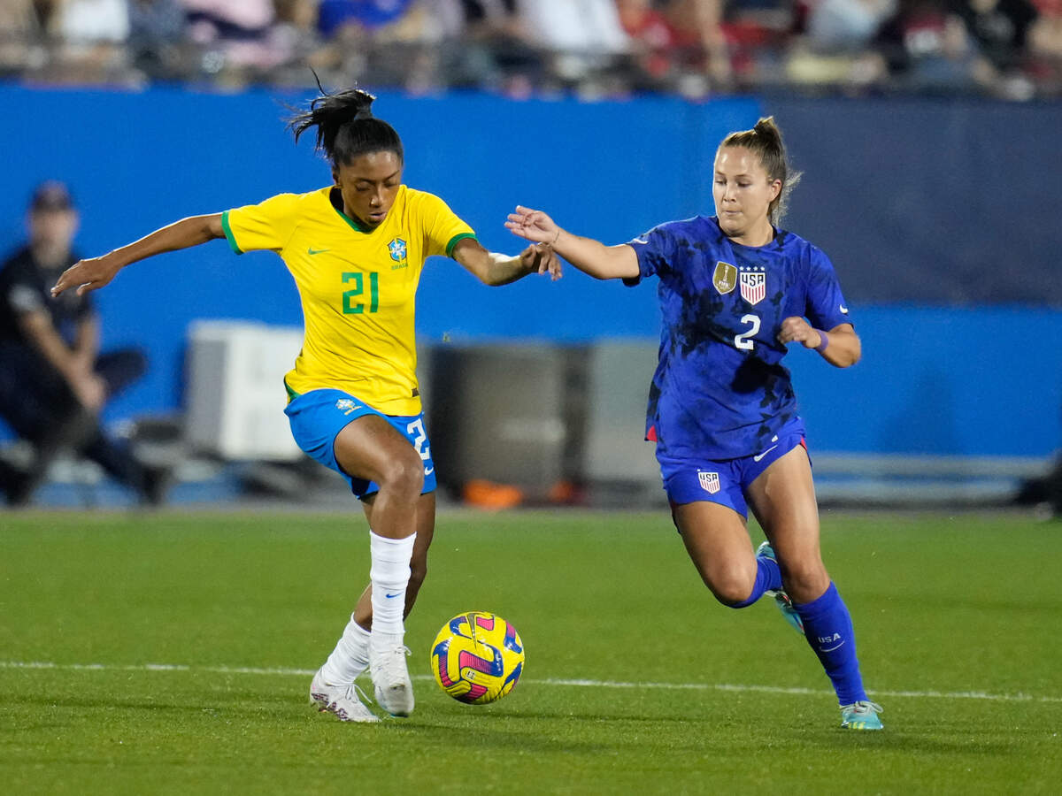 Brazil midfielder Kerolin (21) controls the ball against United States of America midfielder Ashley Sanchez (2) during the second half at Toyota Stadium.