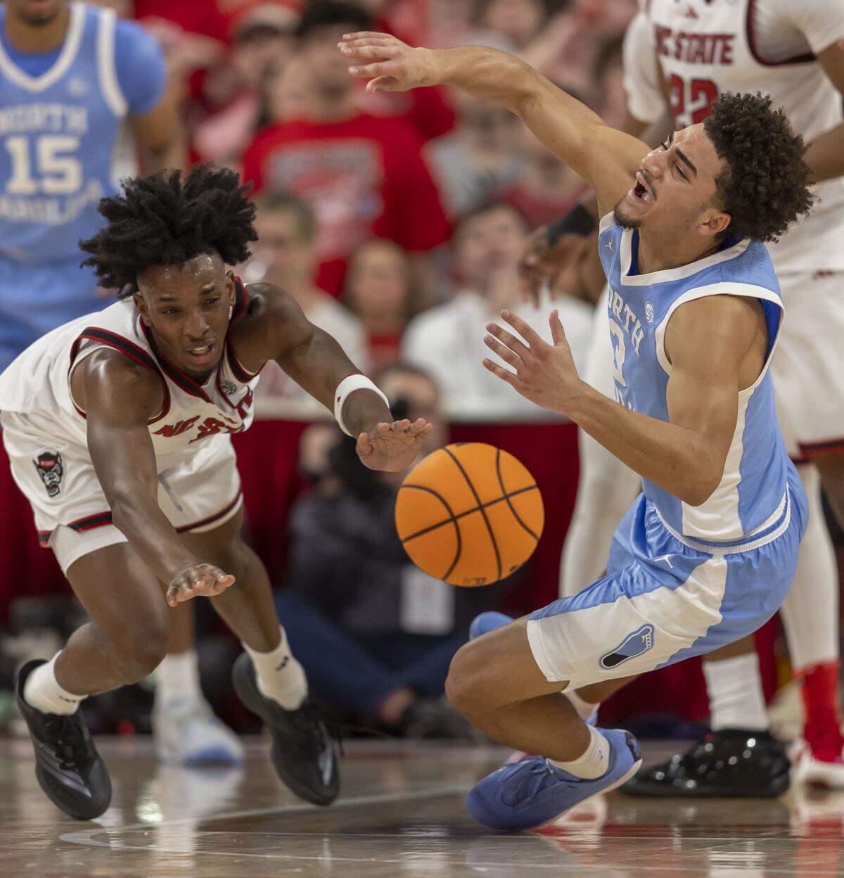 N.C State guard Paul McNeil Jr. (2) forces a turnover by North Carolina guard Derek Dixon (3) in the first half on Tuesday, February 17, 2026 at Lenovo Center in Raleigh, N.C.