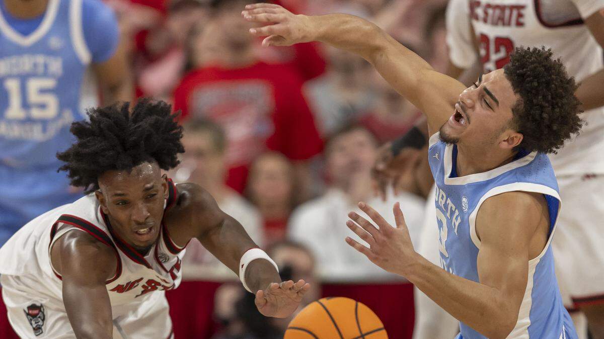 N.C State guard Paul McNeil Jr. (2) forces a turnover by North Carolina guard Derek Dixon (3) in the first half on Tuesday, February 17, 2026 at Lenovo Center in Raleigh, N.C.