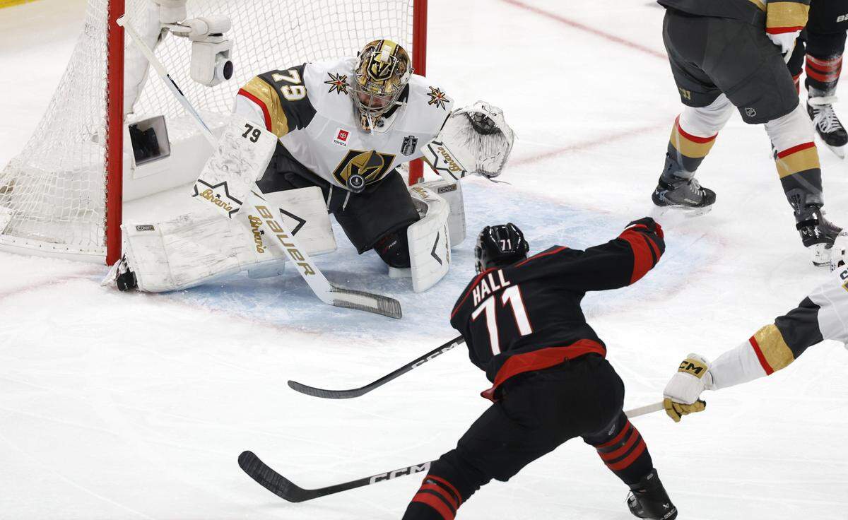 The shot by Carolina's Taylor Hall (71) can’t get past Vegas’ Carter Hart (79) in the first period of the Hurricanes’ game against the Golden Knights in the second game of the Stanley Cup Final at the Lenovo Center in Raleigh, N.C., Thursday, June 4, 2026.