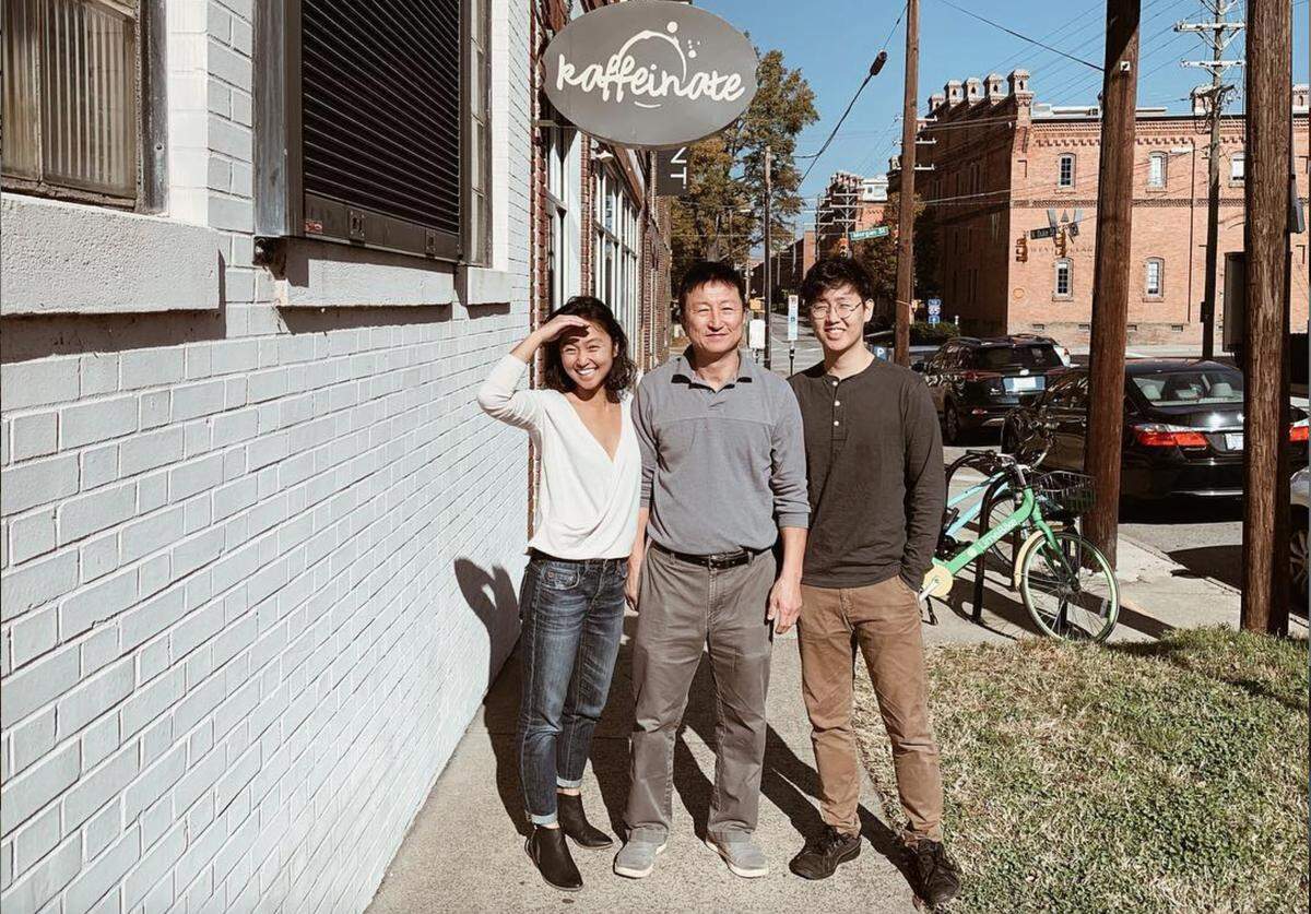 Kong Lee (middle), owned Kaffeinate coffee shop in Durham and died in the explosion that destroyed the shop Wednesday, April 10, 2019. He is pictured with daughter Diana and son Raymond.