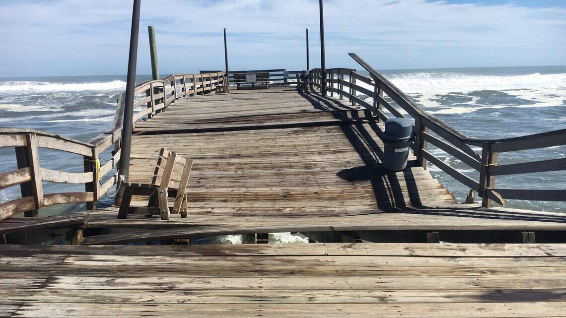 Rough surf damages Outer Banks pier; highway cleanup begins after days of flooding