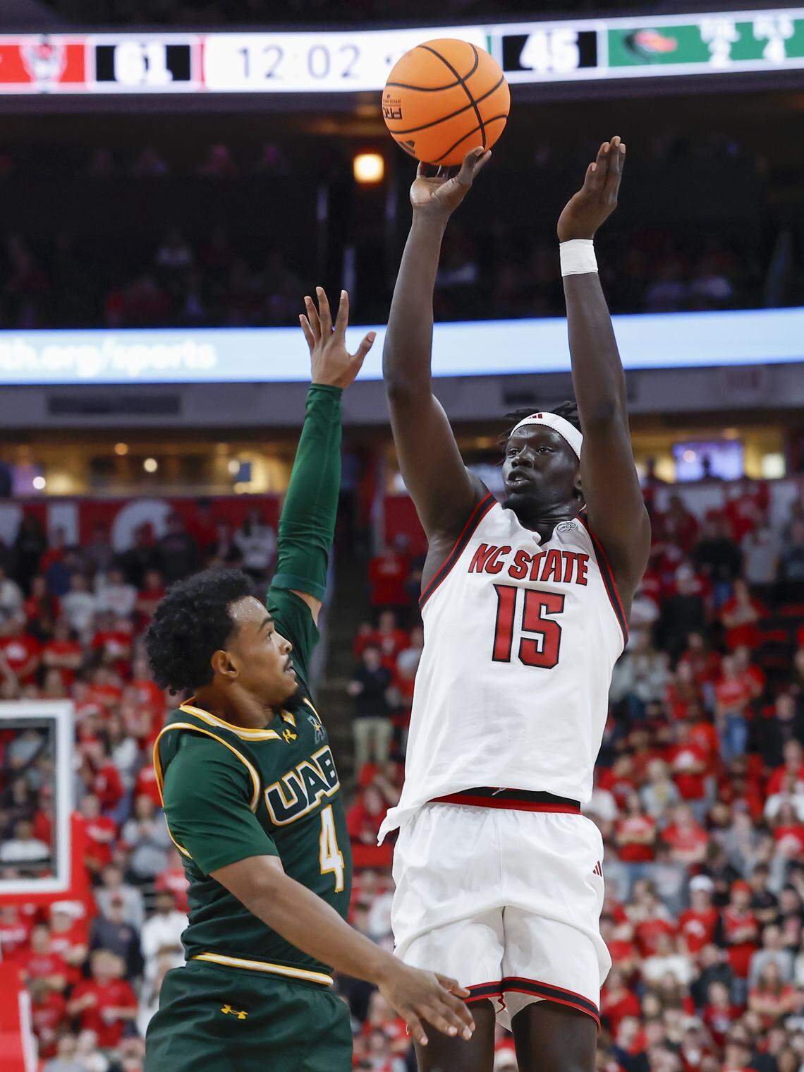 N.C. State’s Jerry Deng shoots over UAB’s Ahmad Robinson during the Wolfpack’s 94-70 win at the Lenovo Center on Nov. 7, 2025, in Raleigh.