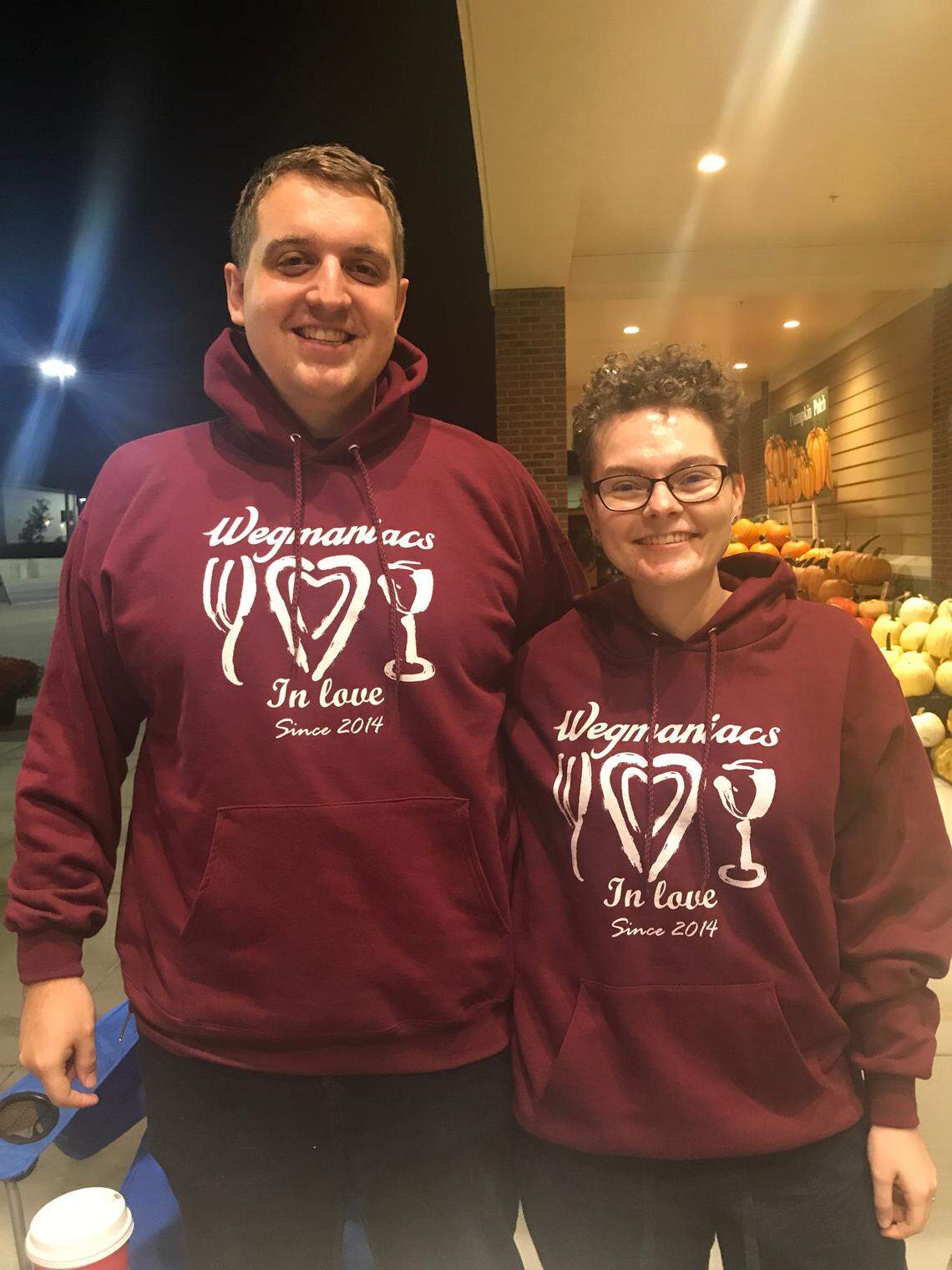 The engaged couple sported matching “Wegmaniac” sweatshirts