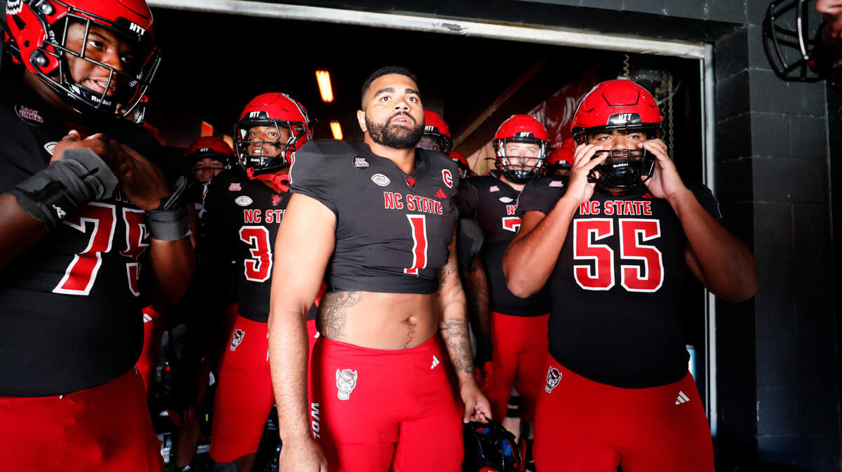 N.C. State defensive end Davin Vann (1) gets ready to head out to warm up before N.C. State’s game against Duke at Carter-Finley Stadium in Raleigh on Saturday, Nov. 9. Vann’s brother, offensive lineman Rylan Vann (55), stands to the right.