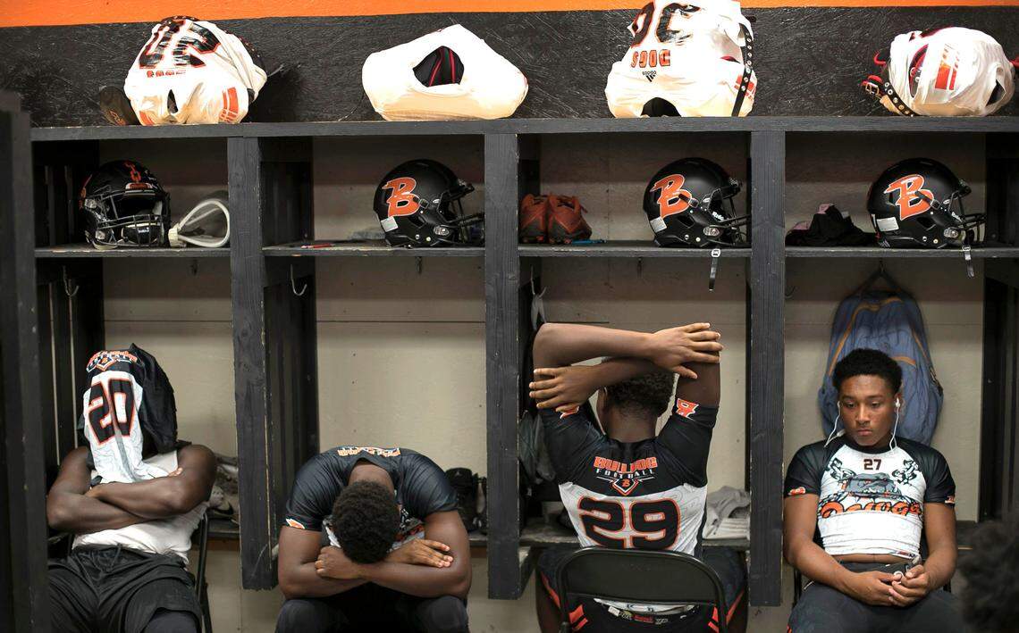 Wallace-Rose Hill players William Miller (20), Rakeem Lanier (30), Jakeem Lanier (29) and Xavier Williams (27), follow their coach Kevin Motsinger’s advice and get their heads focused on football in their locker room before boarding their bus for the trip to Seven Springs on Friday, October 5, 2018 in Teachey, N.C. It was the first game for the team in nearly a month following Hurricane Florence.
