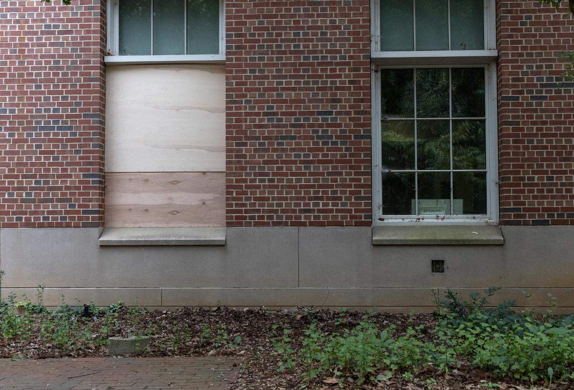A window is boarded up at Caudill Laboratories on Tuesday, Aug. 29, 2023, on the campus of UNC-Chapel Hill. A graduate student was arrested and charged with first-degree murder following a Monday shooting at the laboratories that left a member of the faculty dead.