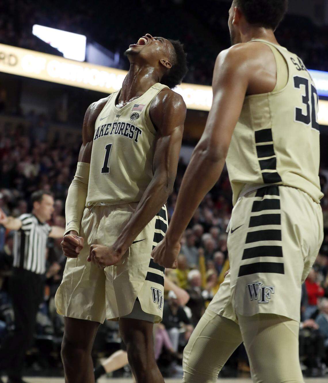 Wake Forest’s Isaiah Mucius (1) celebrates with Olivier Sarr (30) during the first half of N.C. State’s game against Wake Forest at LJVM Coliseum in Winston-Salem, N.C., Tuesday, January 15, 2019.