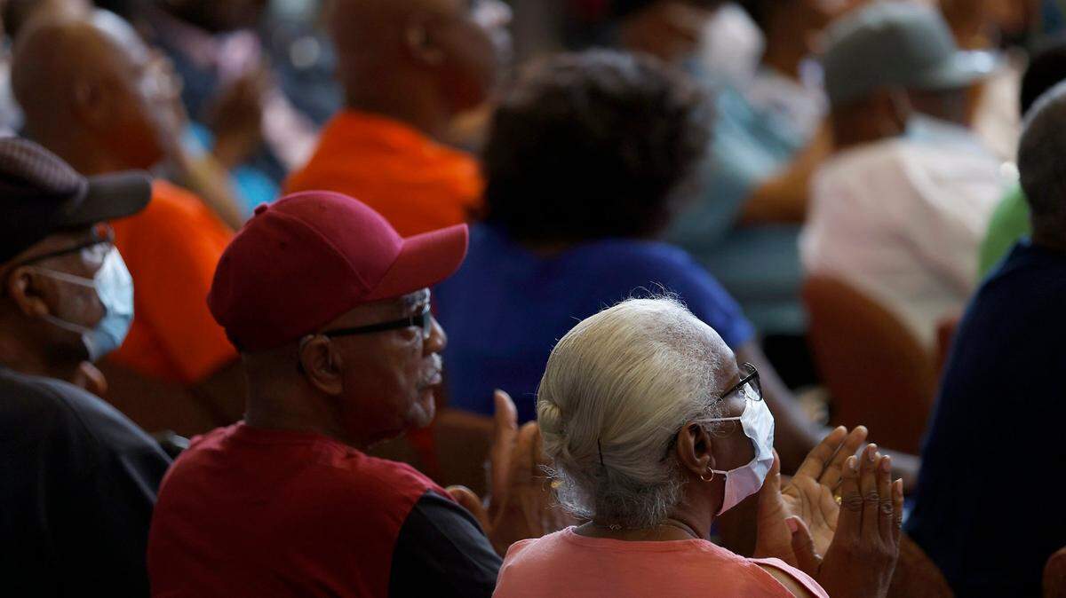 Guests listen as North Carolina Gov. Roy Cooper speaks at the Durham Center for Senior Life on Thursday, Sept. 1, 2022, in Durham, N.C.