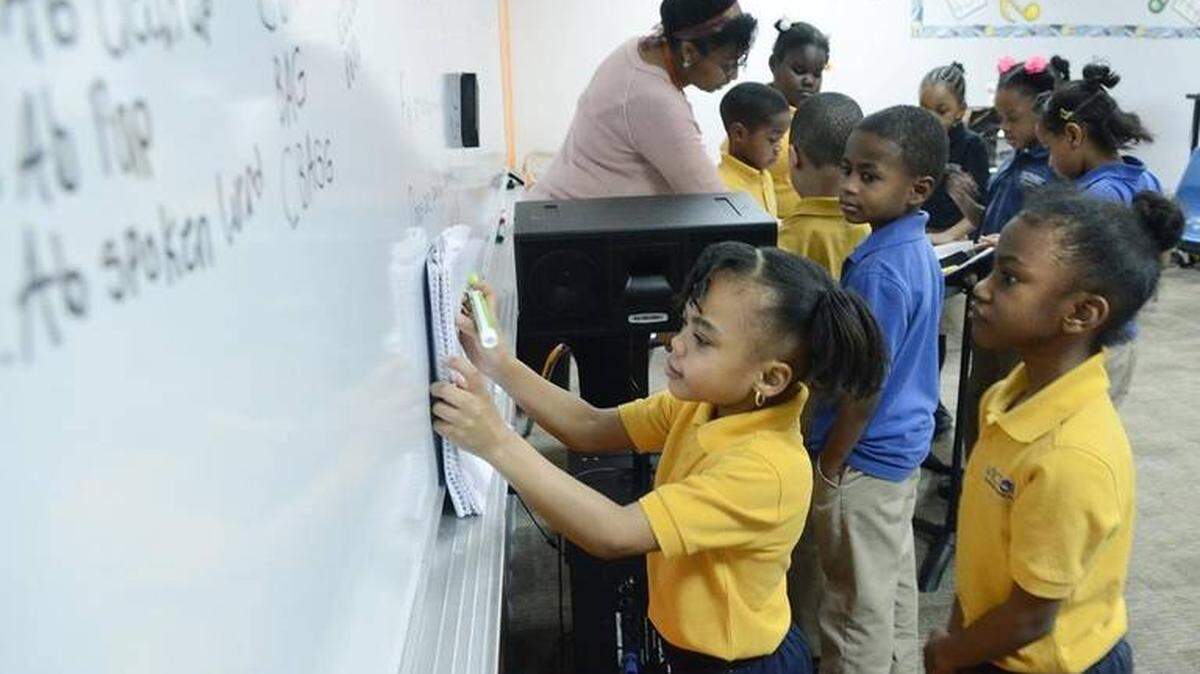 Students in this 2016 photo copy musical keys onto the board at Charlotte’s Victory Christian Center School, a beneficiary of North Carolina’s Opportunity Scholarship program.