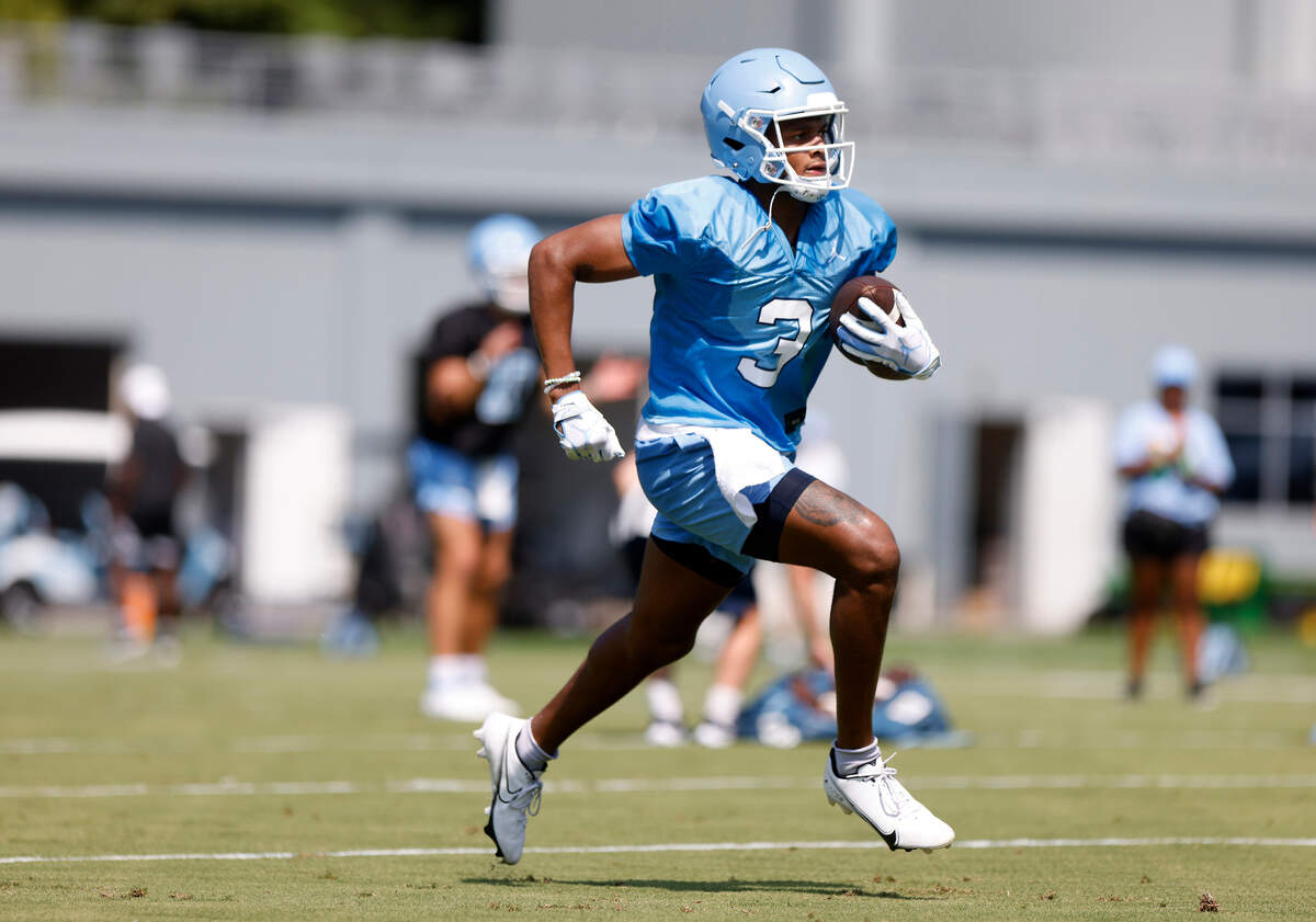 North Carolina wide receiver Antoine Green runs the ball during UNC’s first football practice of the season on Friday, July 29, 2022, in Chapel Hill, N.C.