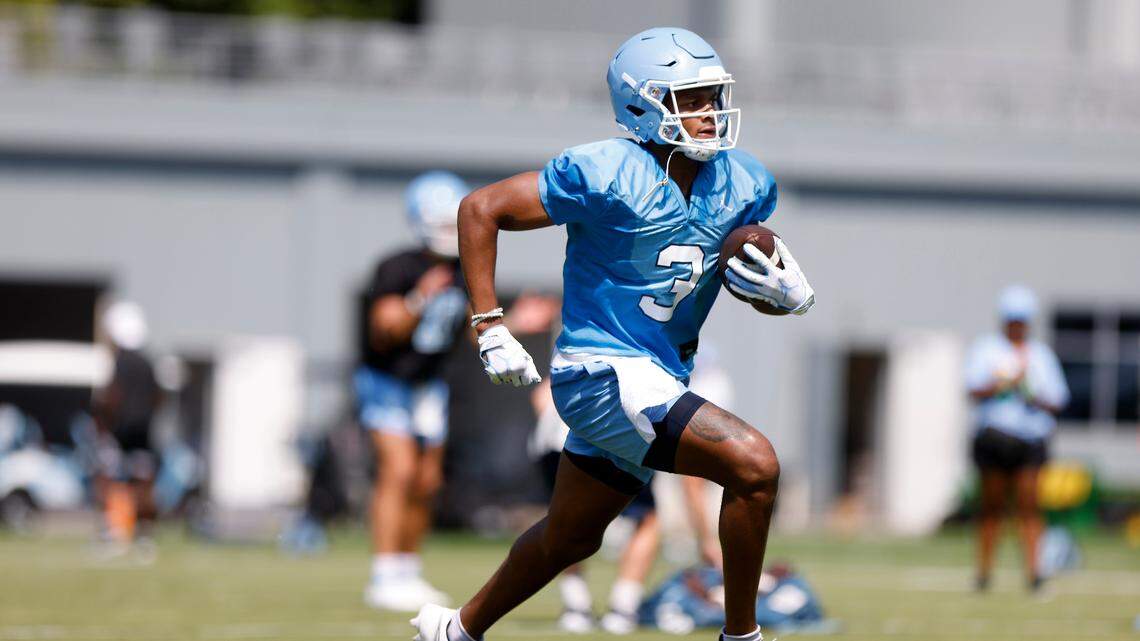 North Carolina wide receiver Antoine Green runs the ball during UNC’s first football practice of the season on Friday, July 29, 2022, in Chapel Hill, N.C.