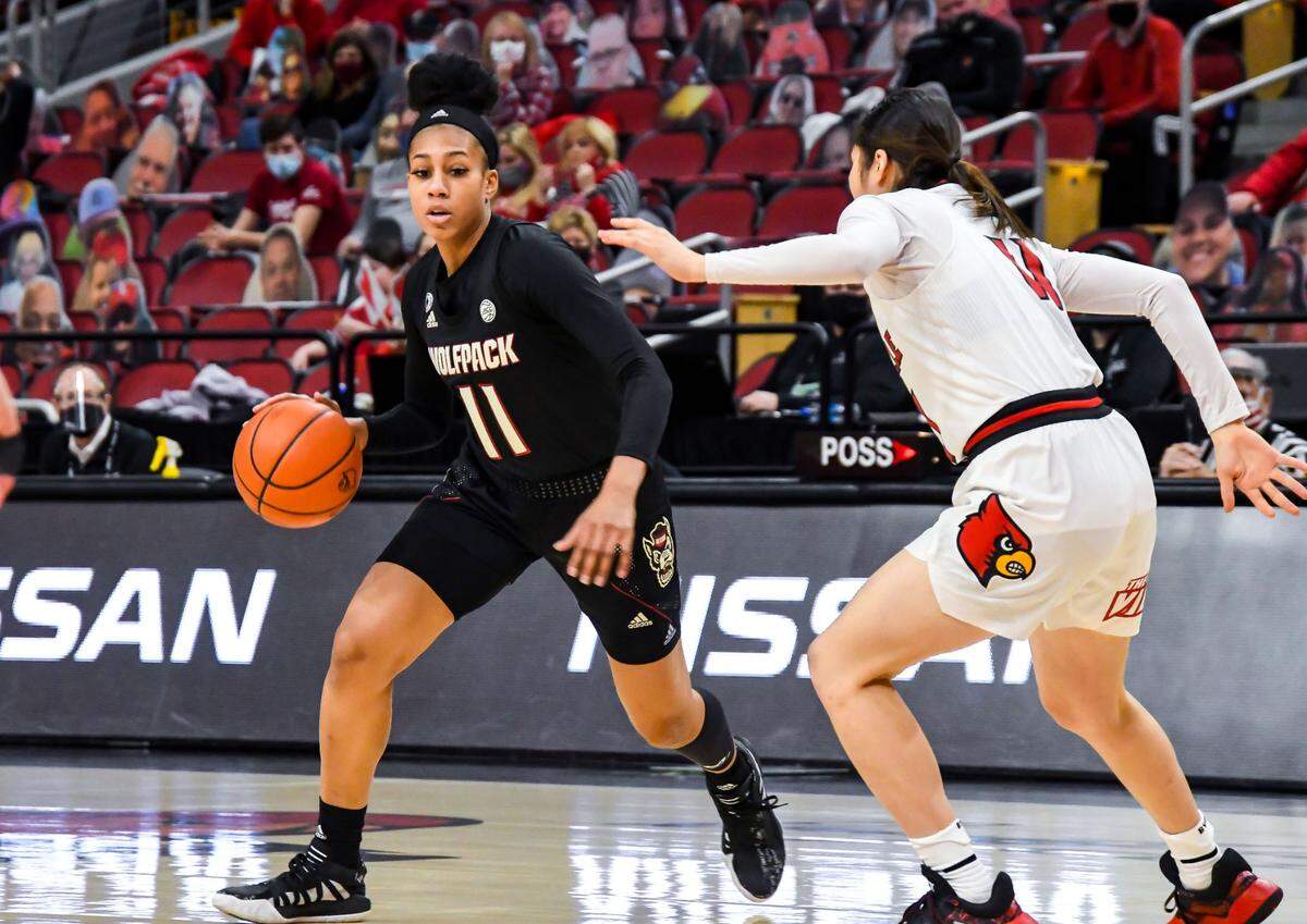N.C. State’s Jakia Brown-Turner (11) looks for room during the Wolfpack’s game against Louisville at KFC Yum! Center in Louisville, Ky. Monday, February 1, 2021.