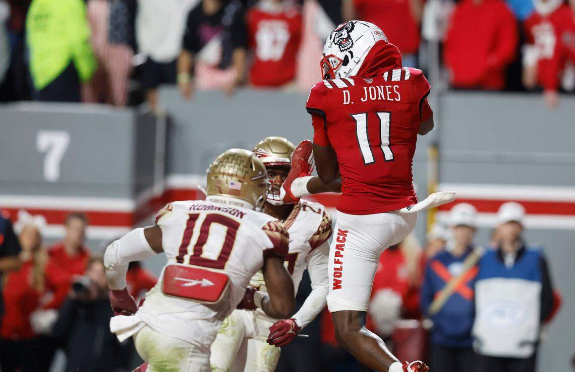 N.C. State wide receiver Darryl Jones (11) makes a 10-yard touchdown reception in the second half of N.C. State’s game against Florida State at Carter-Finley Stadium in Raleigh, N.C., Saturday, Oct. 8, 2022.
